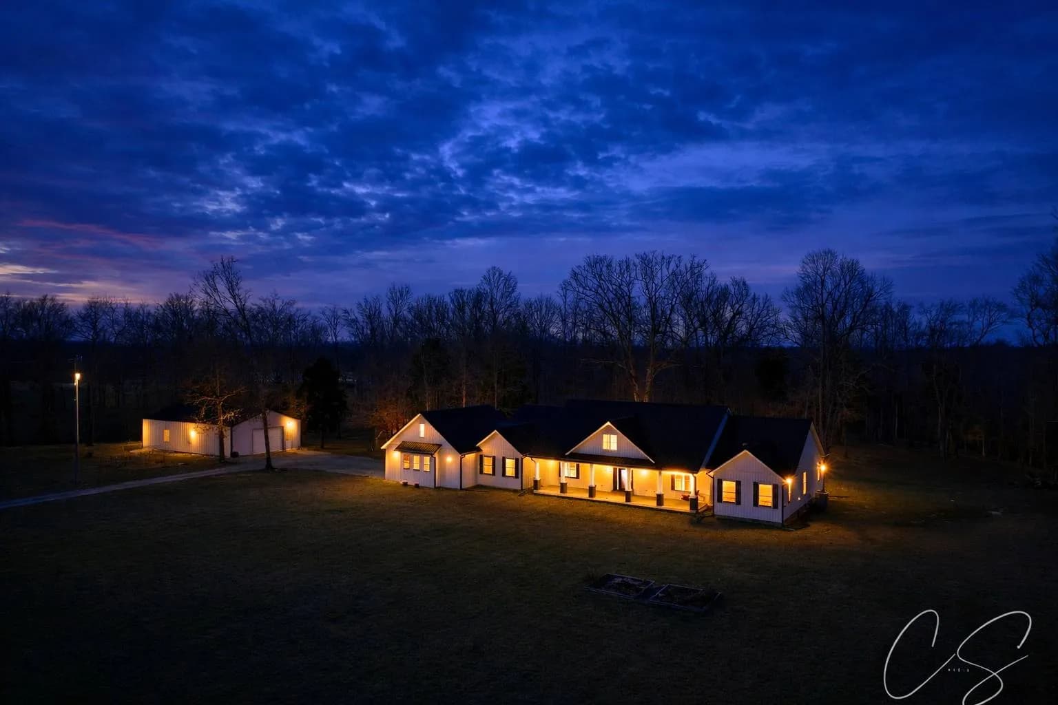 Twilight aerial drone photography of a Kentucky property at dusk